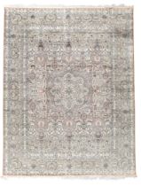 A Persian silk Qum carpet, last quarter 20th century, the central field with cusped medallion sur...