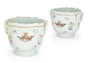 A pair of Chinese Export porcelain famille rose armorial jardinières, 18th century, with twin han...