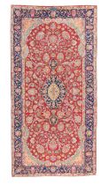 A Persian Kirman rug, signed, last quarter 20th century, the central field with floral medallion ...