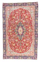A Persian Kirman rug, last quarter 20th century, the central field with floral medallion surround...