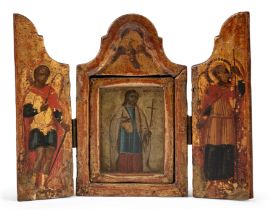 A Greek parcel-gilt and polychrome painted portable triptych icon, late 19th century, with centra...