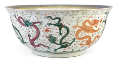 A very large modern Chinese porcelain famille rose bowl, apocryphal Guangxu six character mark to...