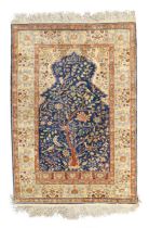 A Turkish silk Kayseri rug, second quarter 20th century, the mihrab field with tree of life desig...
