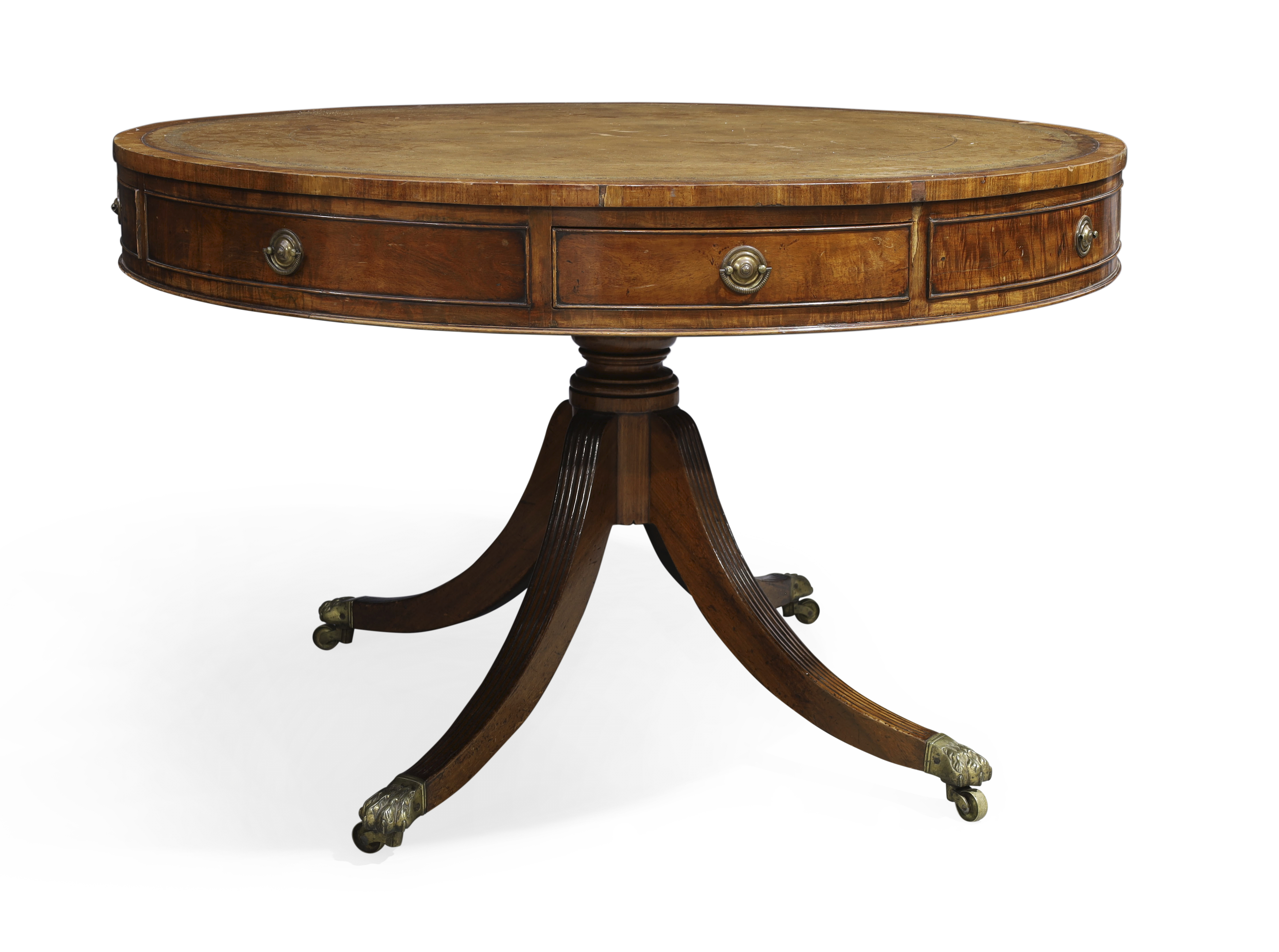 A George III mahogany library drum table, first quarter 19th century, tooled leather top above fo...