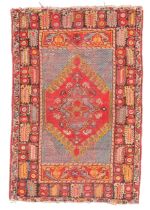 A Turkish Melas rug, first quarter 20th century, the central field with diamond medallion, on a r...