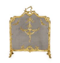 A French gilt-bronze fire screen, of Louis XV style, centred by a ribbon-tied scrolling cartouche...