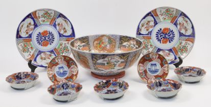 A group of Japanese Imari palette porcelain, Meiji - 20th century, to include a large footed punc...