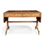 A George III rosewood sofa table, first quarter 19th century, the rounded rectangular twin-flap t...