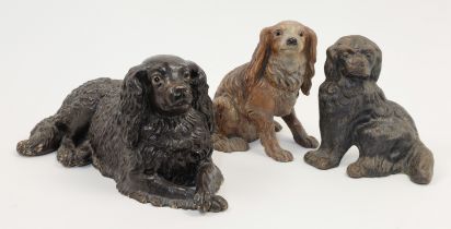 A group of dog figures and sculptures, late 19th / 20th century, to include: two terracotta spani...