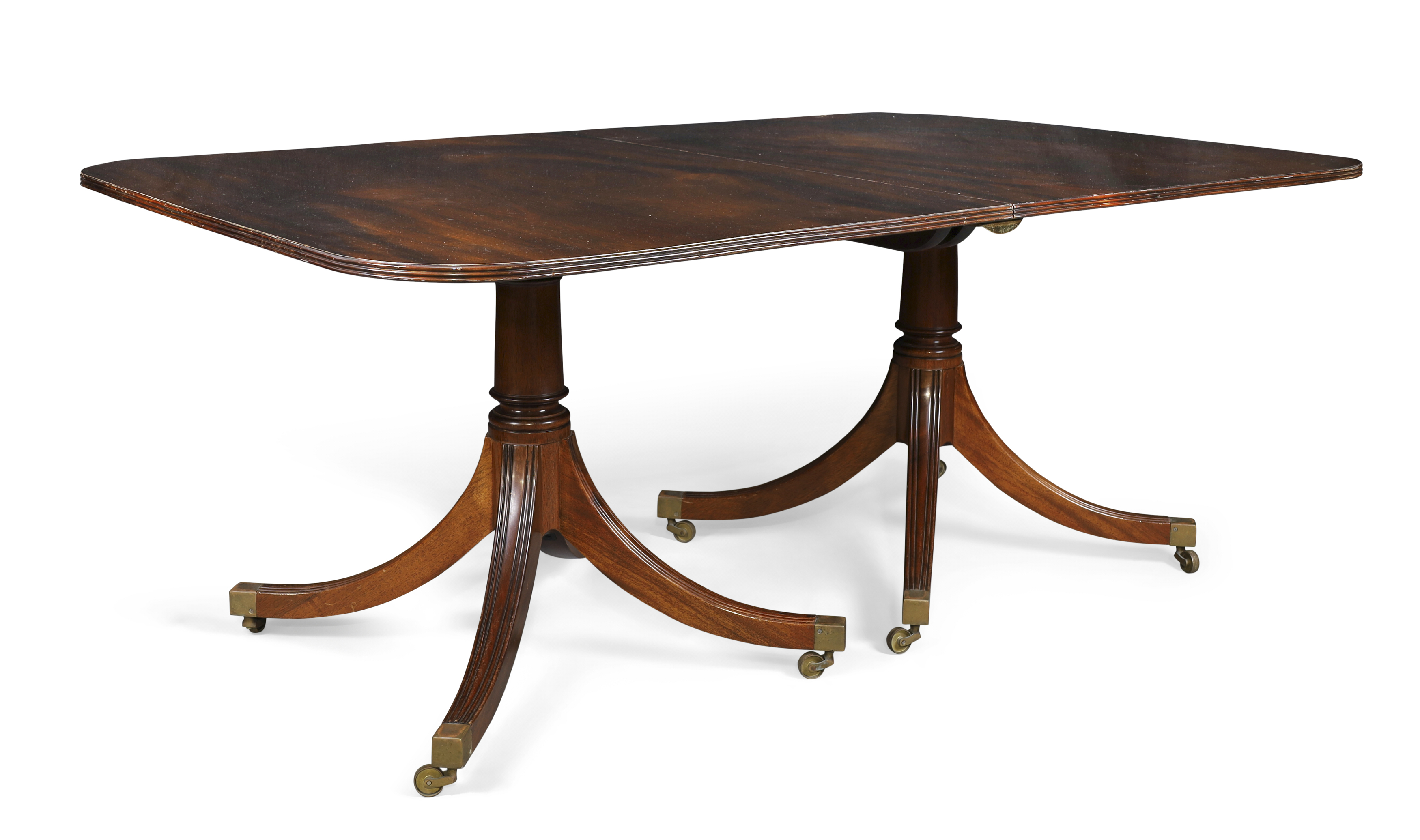 An English mahogany twin pedestal dining table by William Tillman, George III style, 20th century...