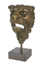 A Continental bronze lion mask, 18th / 19th century, possibly a furniture mount, on later stand, ...