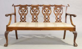 An English mahogany quadruple chair back sofa by Goodall's, George II Chippendale style, first qu...