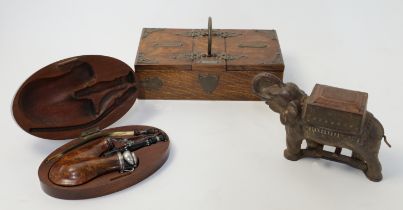 A group of smoker's items and ephemera, late 19th / early 20th century, to include: a cast iron c...