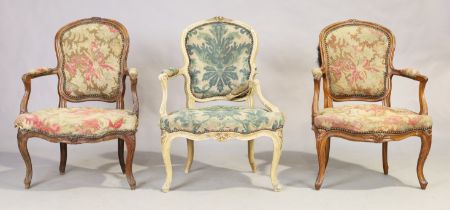 A Louis XV beechwood fauteuil, third quarter 18th century, and two matched French fauteuils, Loui...