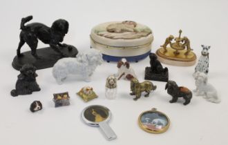 A group of dog figurines and collectibles, 19th - 20th centuries, to include: a bronze model of a...