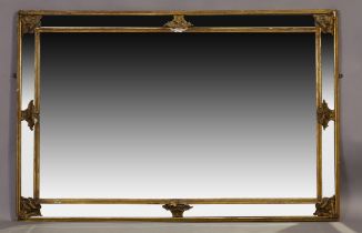 An Italian giltwood mirror, second half 20th century, with central bevelled plate and mirrored bo...