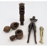 A collection of nutcrackers, 20th century, to include: a decorative Black Forest example carved i...