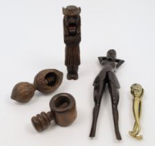 A collection of nutcrackers, 20th century, to include: a decorative Black Forest example carved i...