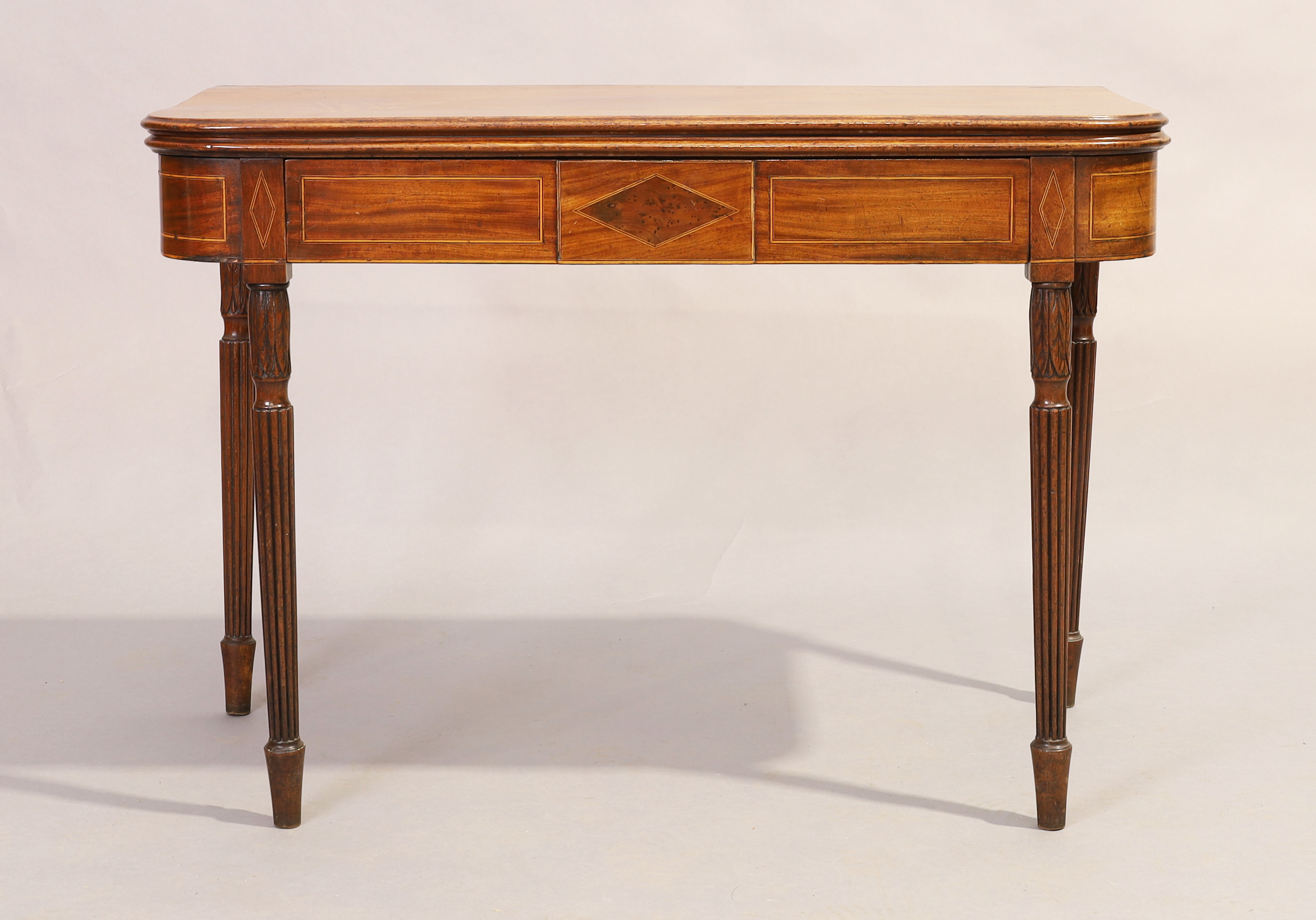 A George III inlaid mahogany tea table, last quarter 18th century, with frieze drawer, on carved ...