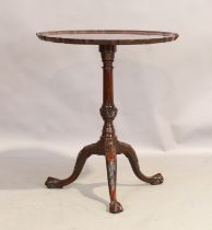 An English mahogany tripod table, George III style, last quarter 19th century, the pie crust top ...