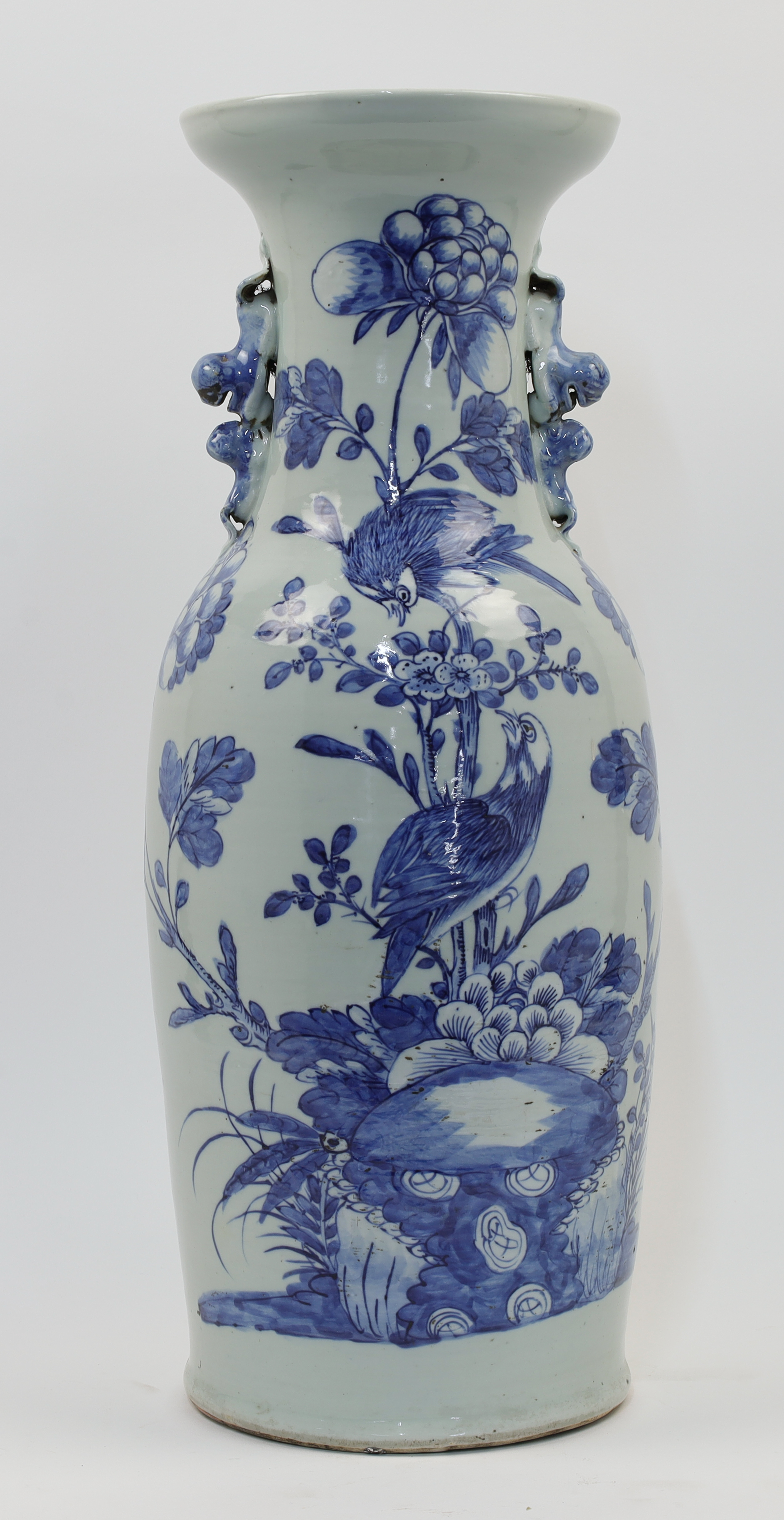 A large Chinese celadon blue and white vase, late 19th / early 20th century, with twin handles mo...