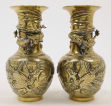 A pair of Chinese bronze dragon vases, Republic period, each with a globular lower body decorated...