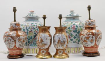 A pair of Chinese famille rose baluster jars and covers, 19th century, decorated to the exteriors...