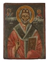 A Greek icon of St Nicholas of Myra, dated 1919, portrayed frontal, half-length, blessing and car...