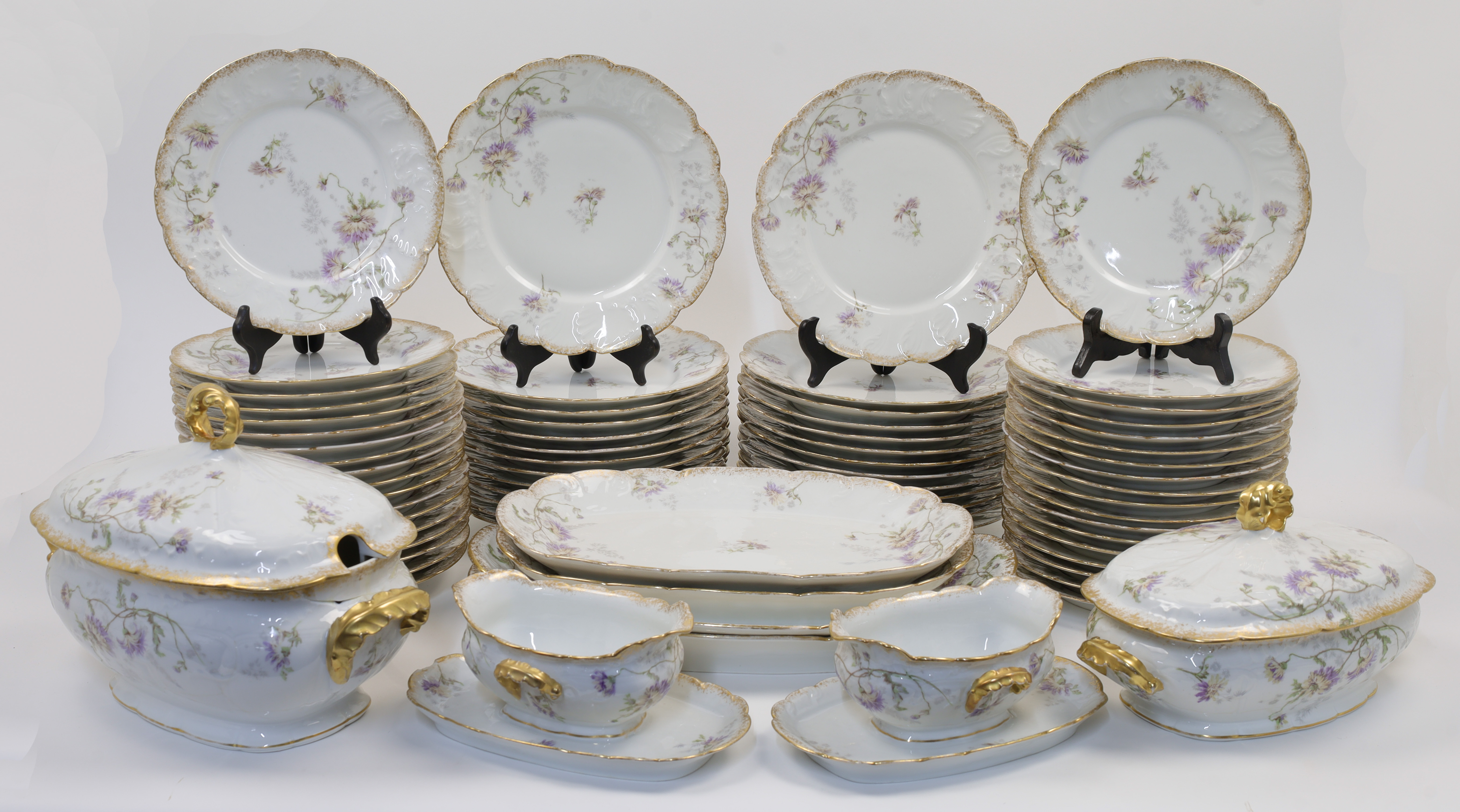 An extensive French porcelain dinner service, probably Limoges, late 19th / early 20th century, r...