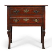 A George II walnut side table, second quarter 18th century, the rectangular top above two drawers...