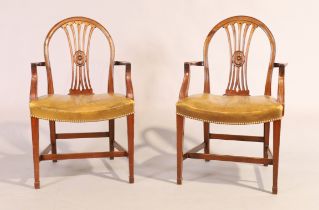 A pair of English mahogany armchairs, Hepplewhite style, 20th century, with brown vinyl upholster...