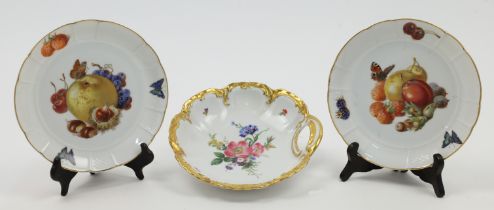 A pair of Rosenthal porcelain plates, 20th century, decorated in Meissen style with motifs of fru...