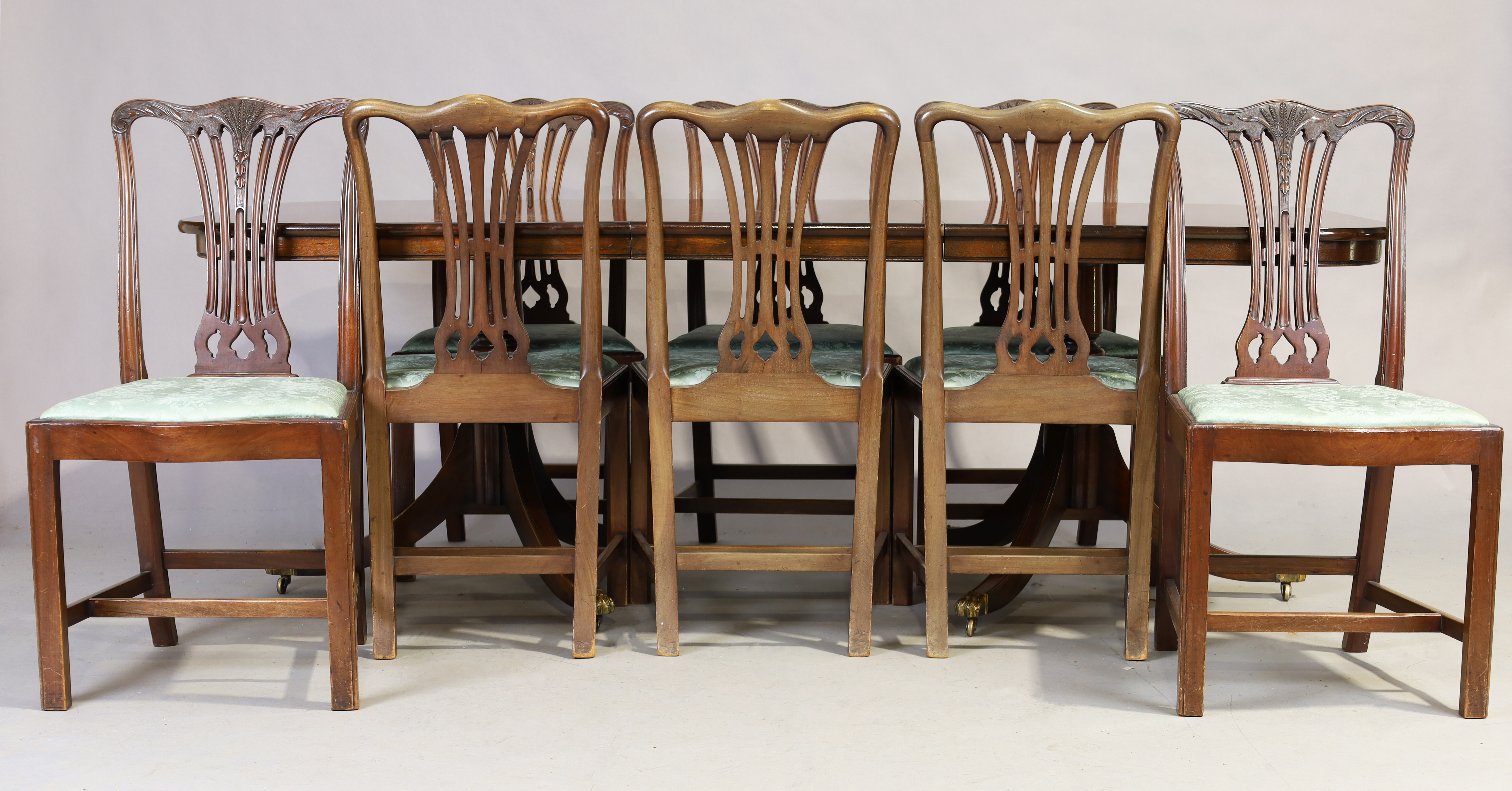 An English mahogany dining table, George III style, 20th century, with on extra leaf, stamped 381...