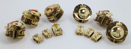 A collection of modern clock movements, of various sizes and makers, including: twin train drum m...