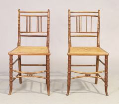 A pair of Victorian mahogany faux bamboo side chairs, last quarter 19th century, with caned seats...