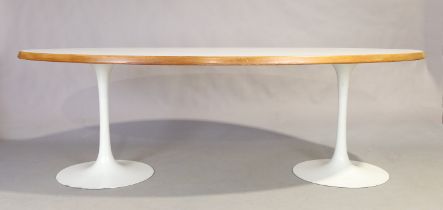 An Arkana oval dining table, third quarter 20th century, with twin tulip pedestal base, 73cm high...