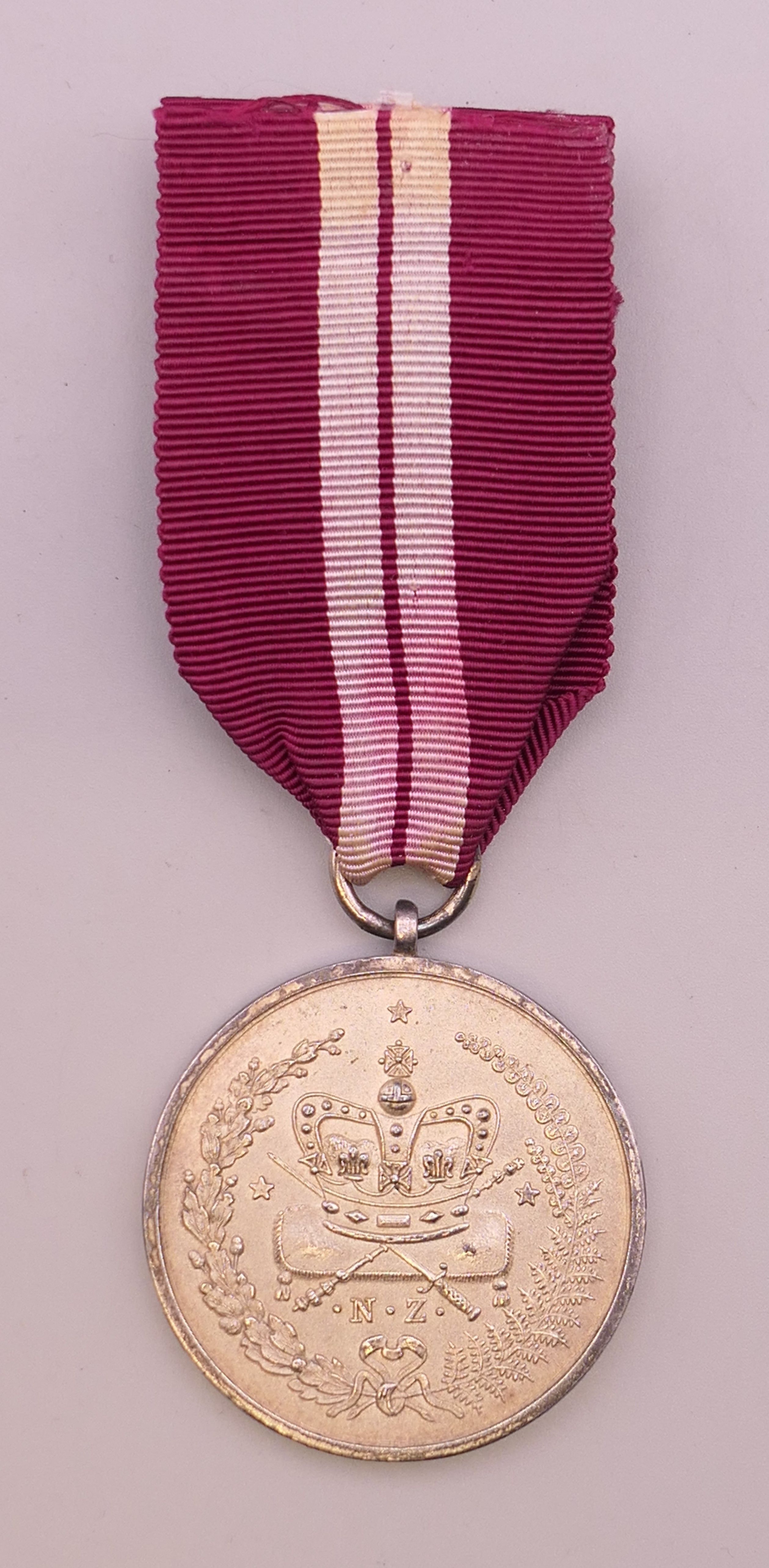 A silver Long and Efficient Service medal.