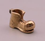 A 9 ct gold charm formed as a boot. 2.2 grammes.