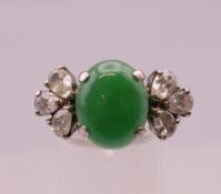 A silver jade and cubic zirconia ring. Ring size N.