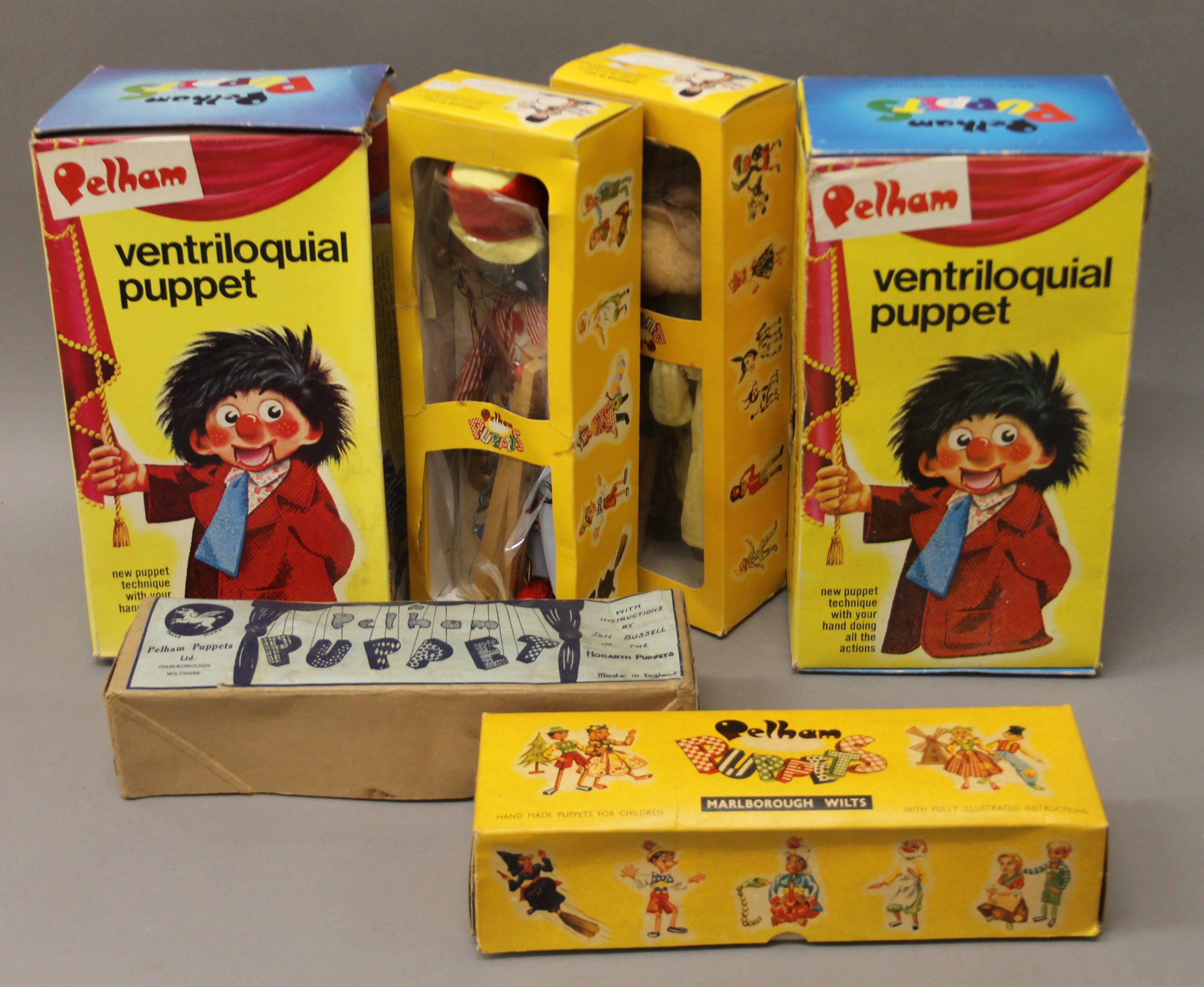 Six boxed Pelham puppets.