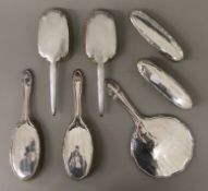 A silver dressing table set.