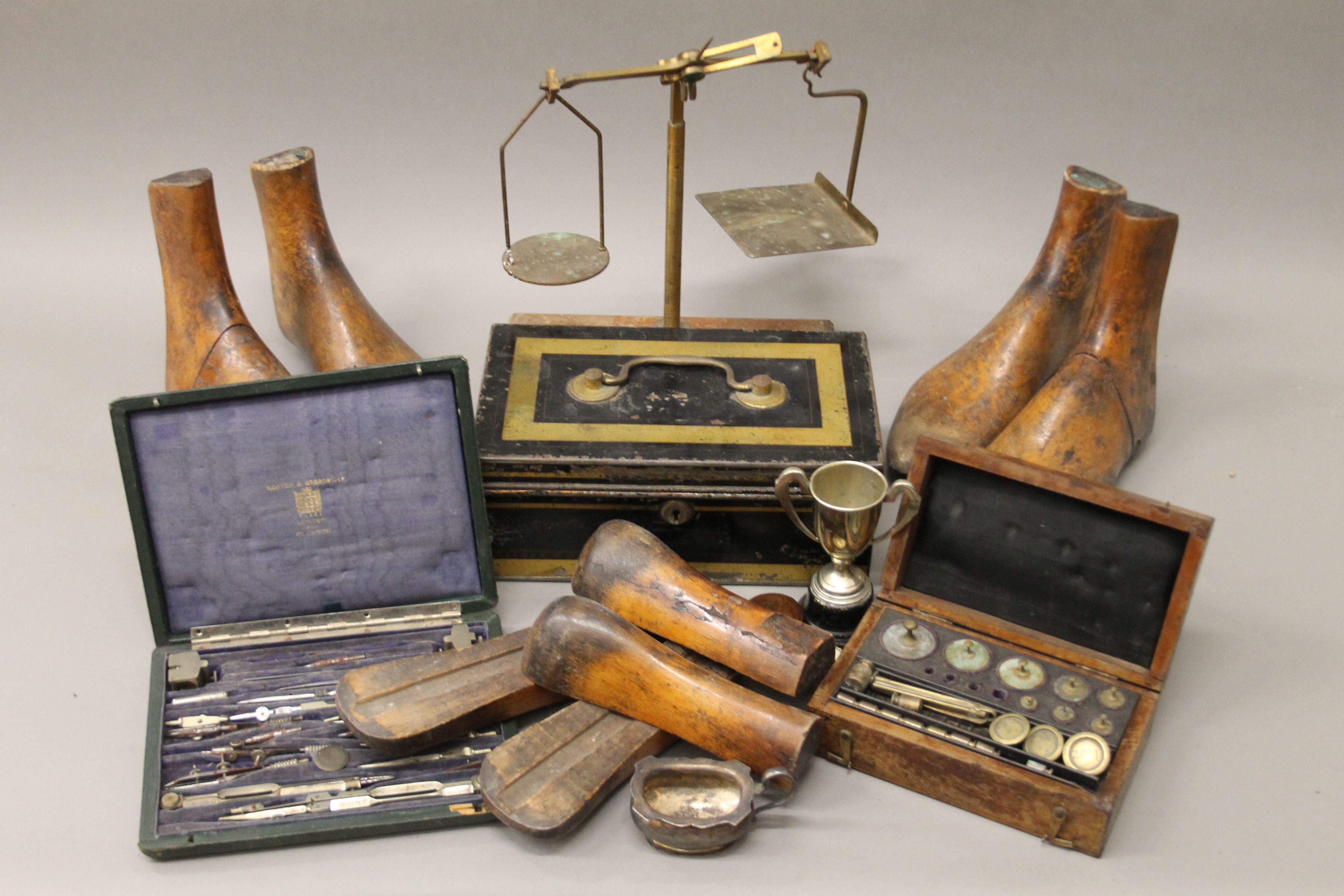 A quantity of miscellaneous items, including shoe lasts, scales, etc.