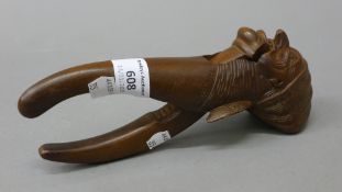 A Blackforest nut cracker of figural form. 20 cm high.