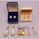 A quantity of various earrings.