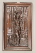 A late 19th/early 20th century leather picture of a Dancing Girl, housed in a mahogany frame.