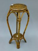 A bamboo jardiniere stand. 61 cm high.