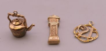 Three 9 ct gold charms. 2.9 grammes.