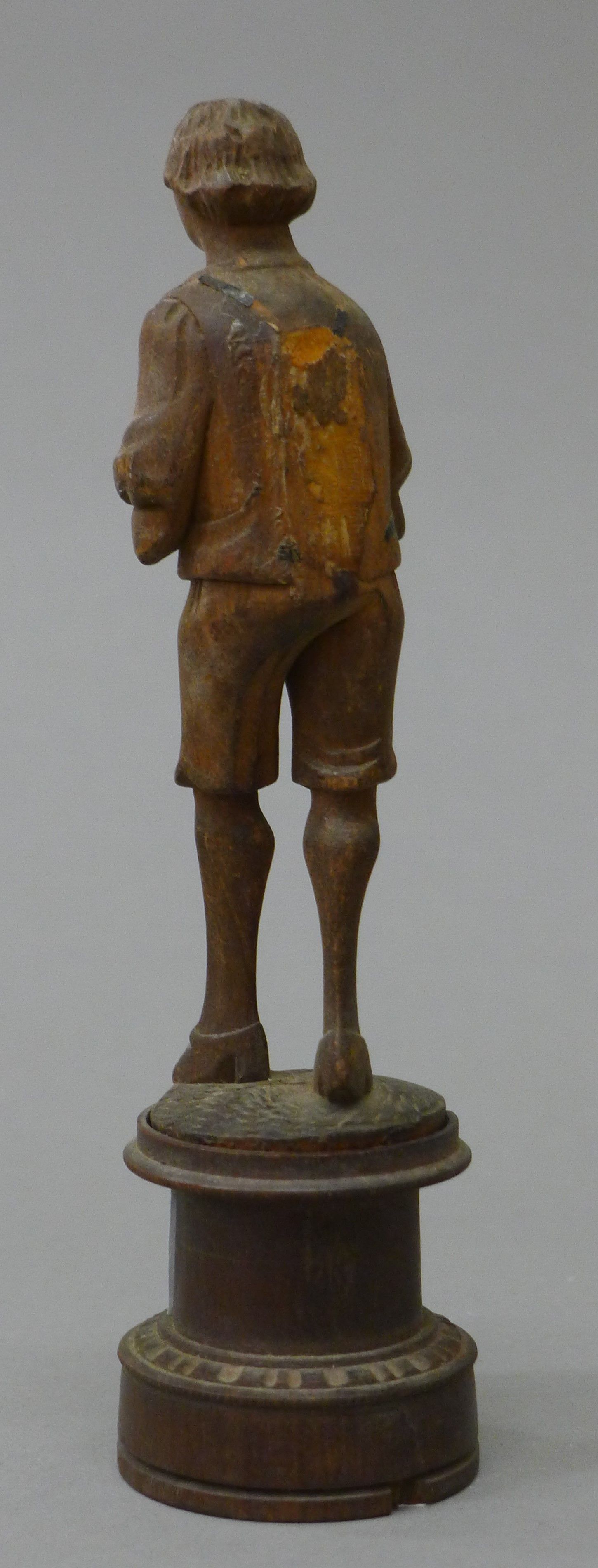 A Blackforest carved figure of a boy. 15 cm high. - Image 3 of 4