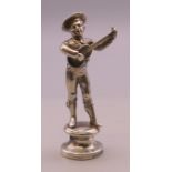 A figural seal formed as a musician. 5.5 cm high.