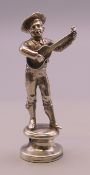 A figural seal formed as a musician. 5.5 cm high.
